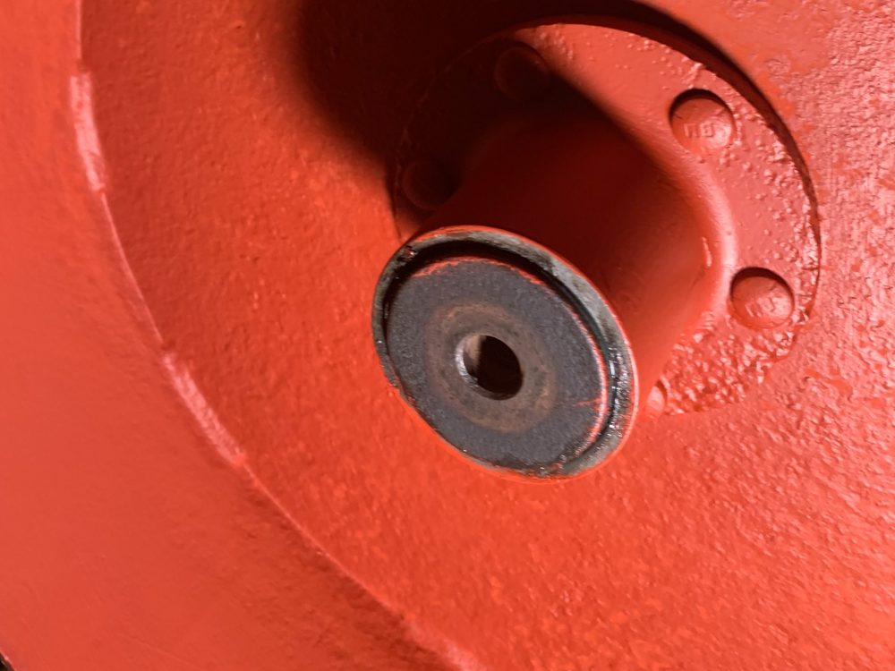 Customer photo of a cast iron housing coated in XionLab red oxide rust converter and primer