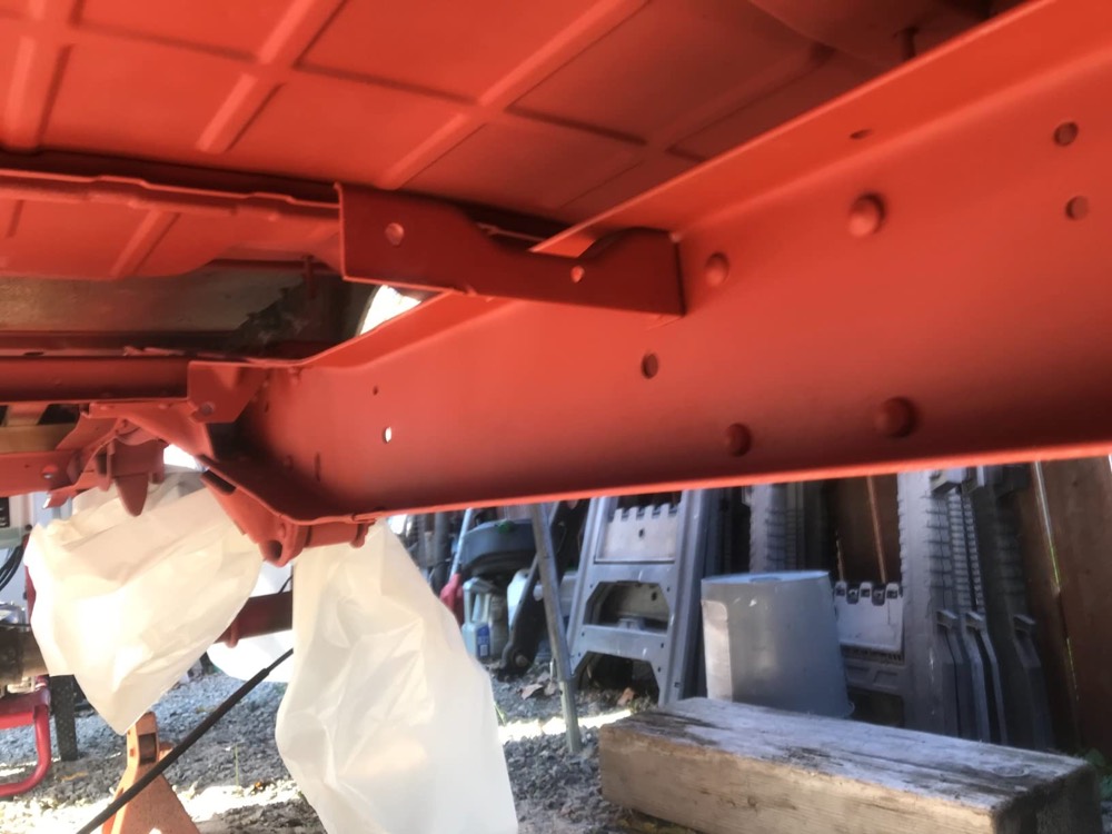 Customer photo of the underside of a vehicle, frame rail and floor pan coated in XionLab rust converter and primer