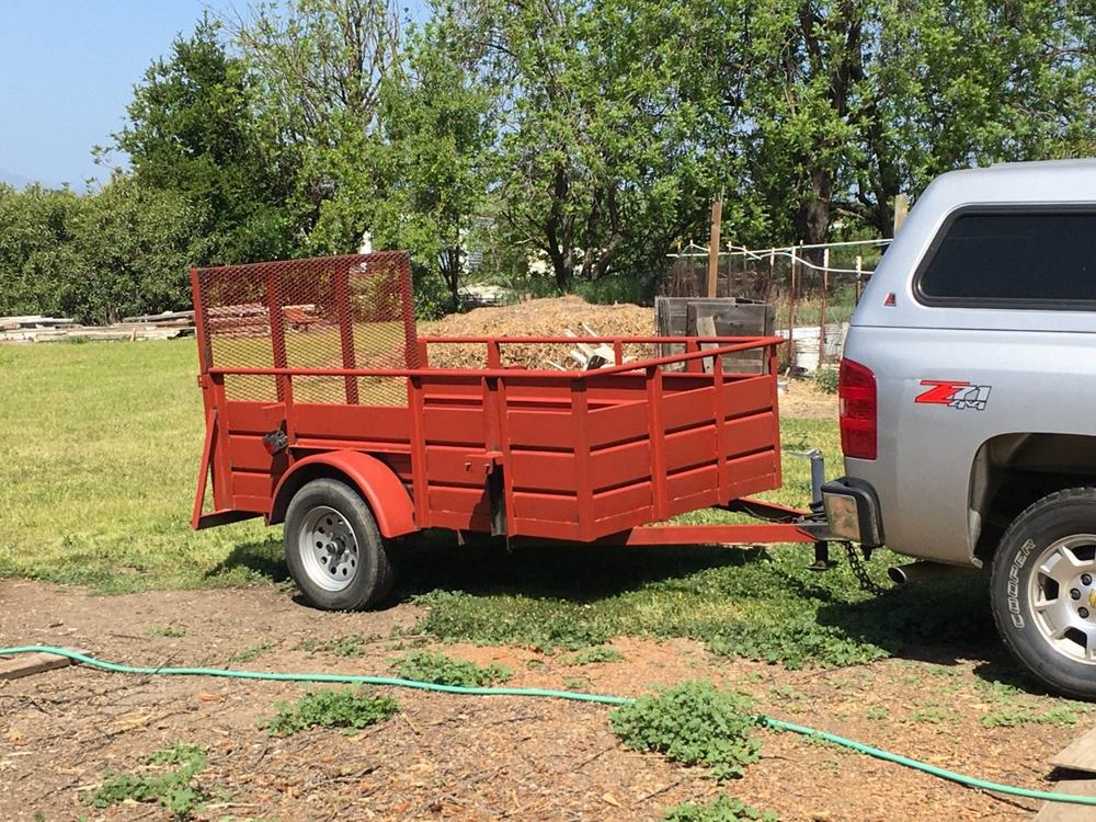 Customer photo of a utility trailer coated in XionLab red oxide rust converter and primer