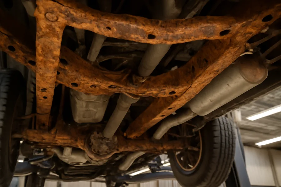 Ford F-150 frame underside showing rust on frame rails